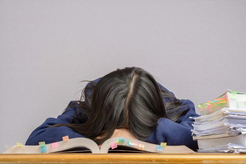 woman with her head on the desk