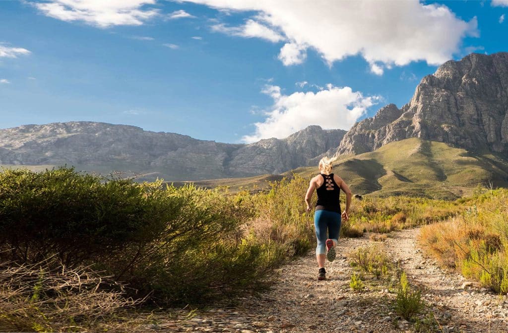 female runner in mountains