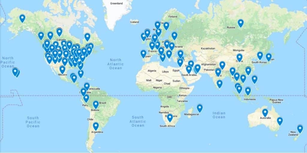pins on a world map showing where all the uesca coaches are from