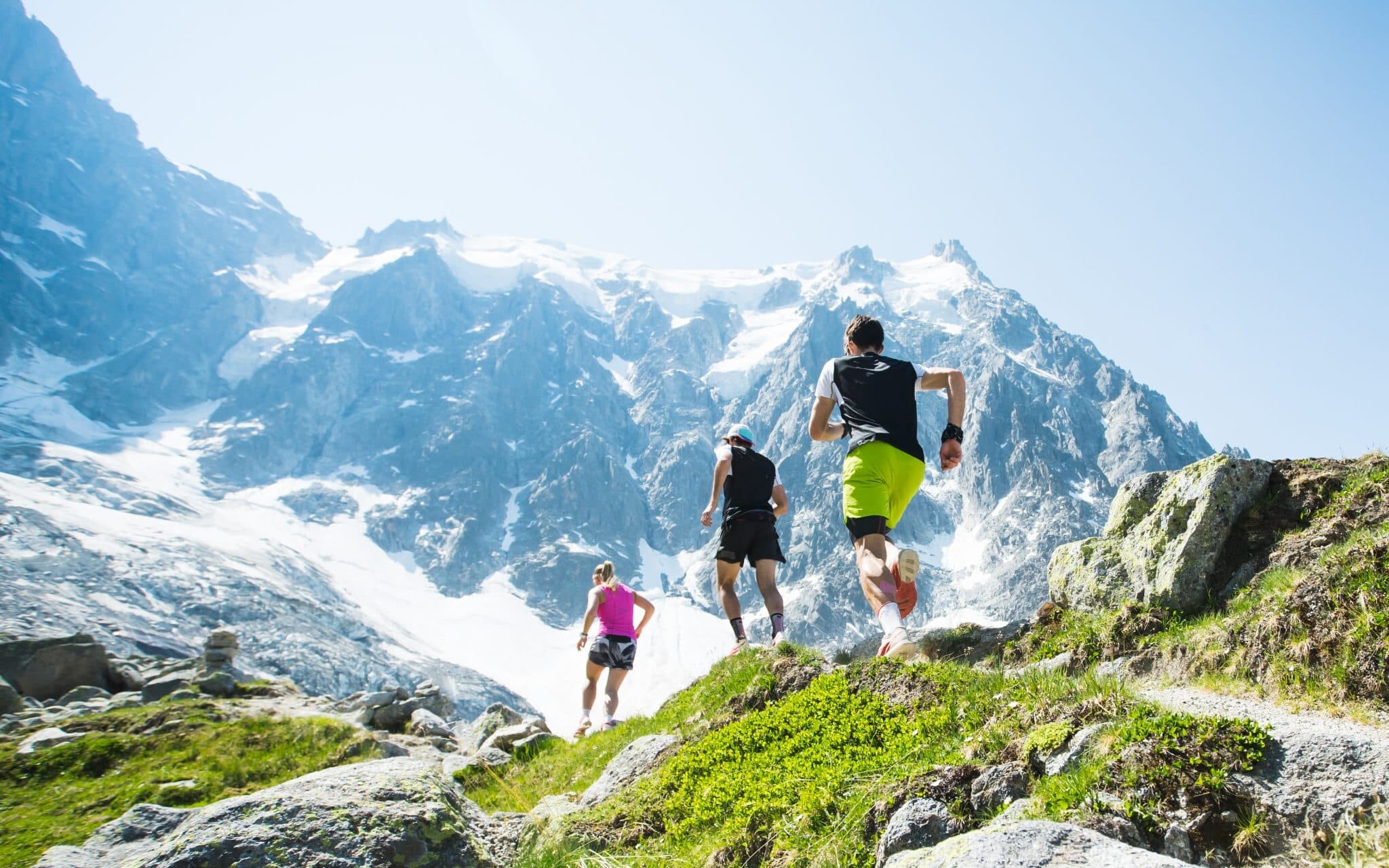 Runners in high mountains