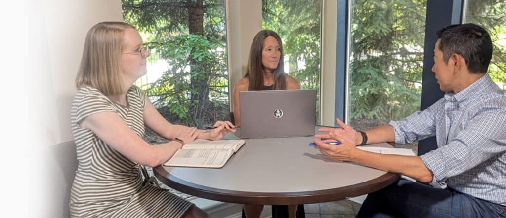 Rick, Cindy and Tessa in a meeting