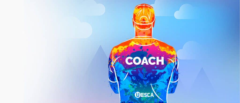 a silhouette of a runner from behind in a colorful shirt that says UESCA Coach