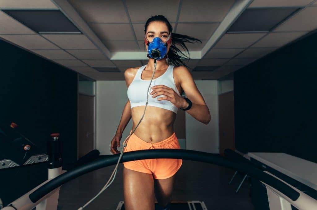 A female performing a VO2 max test on a treadmill