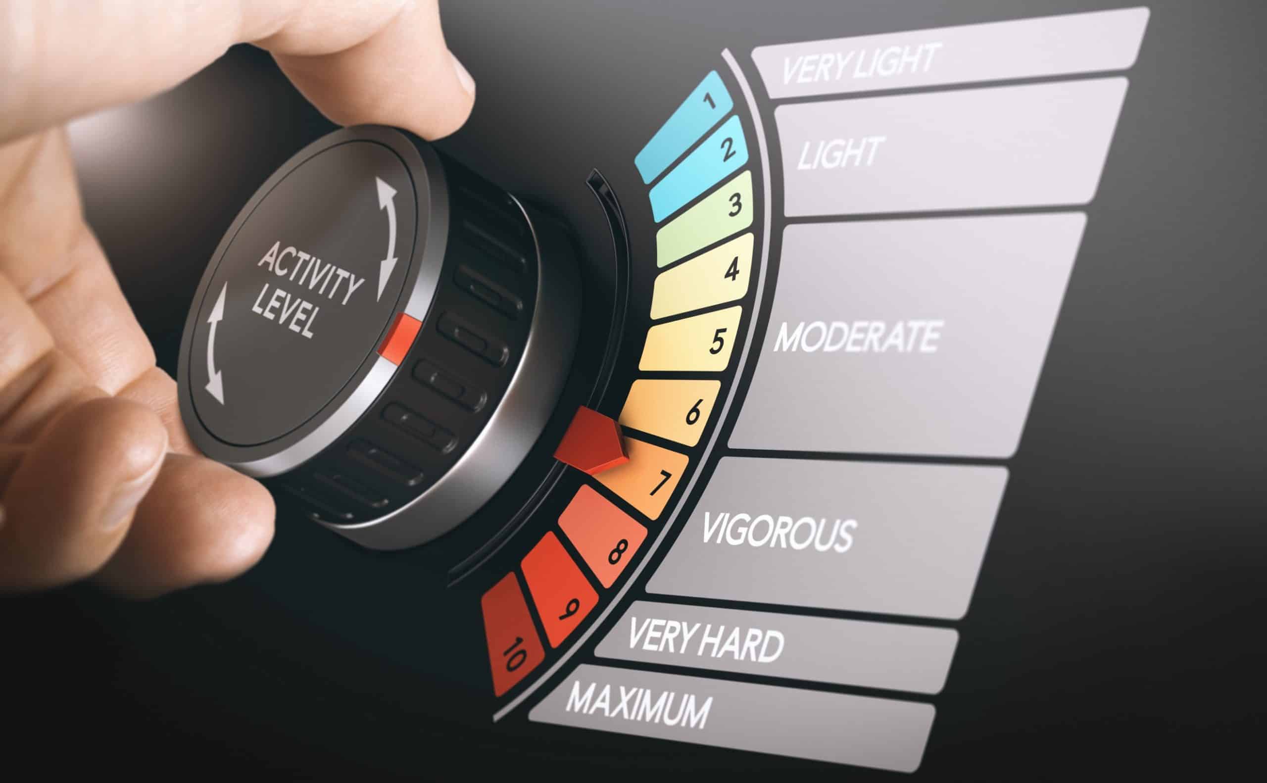 A hand turning a dial that selects Activity Intensity
