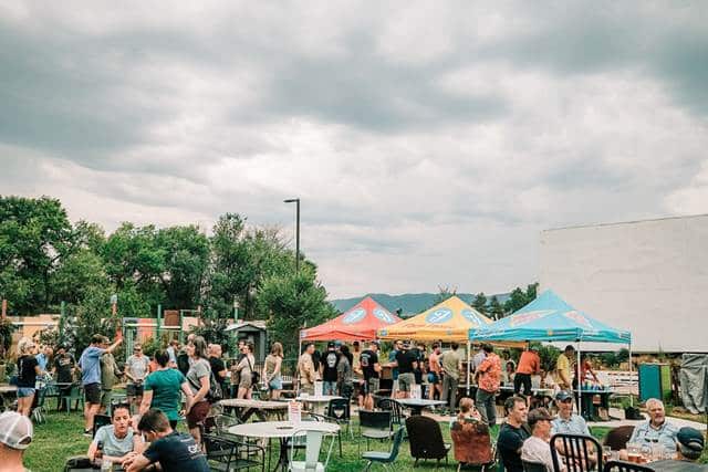 People and tents at a venue
