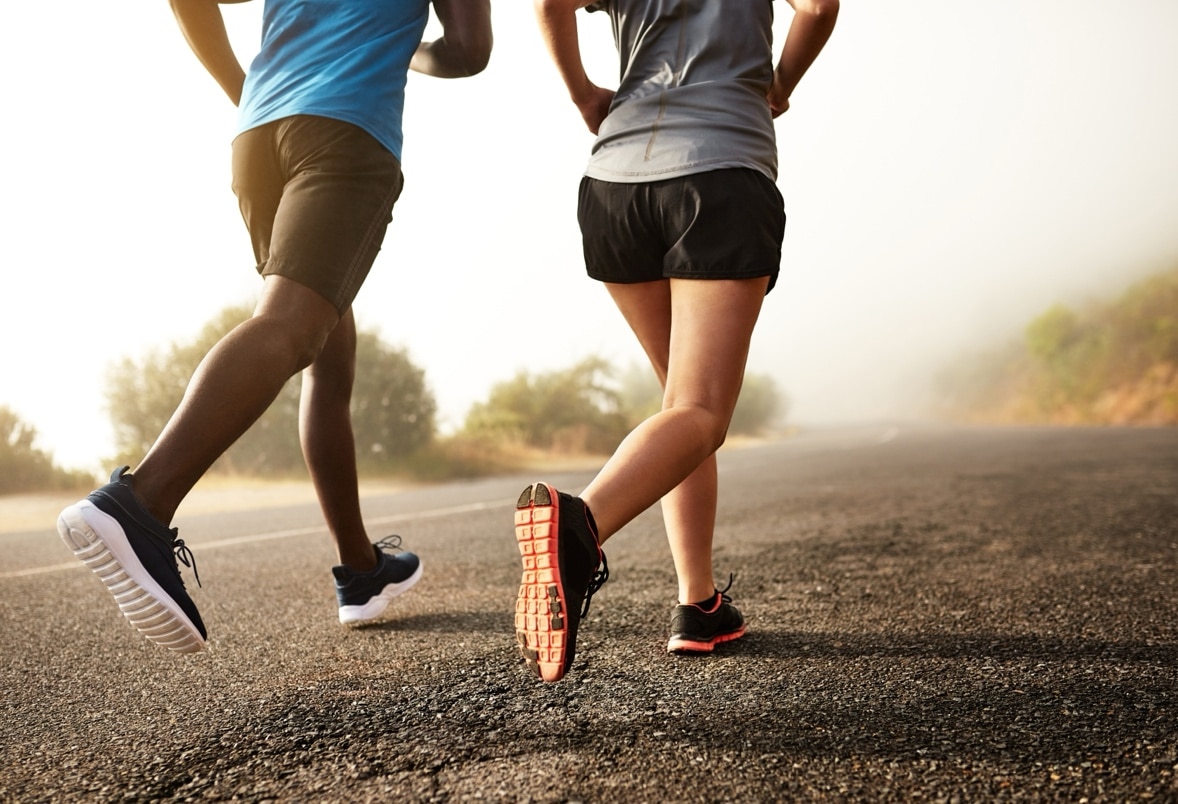 A couple of people running on a road
AI-generated content may be incorrect.